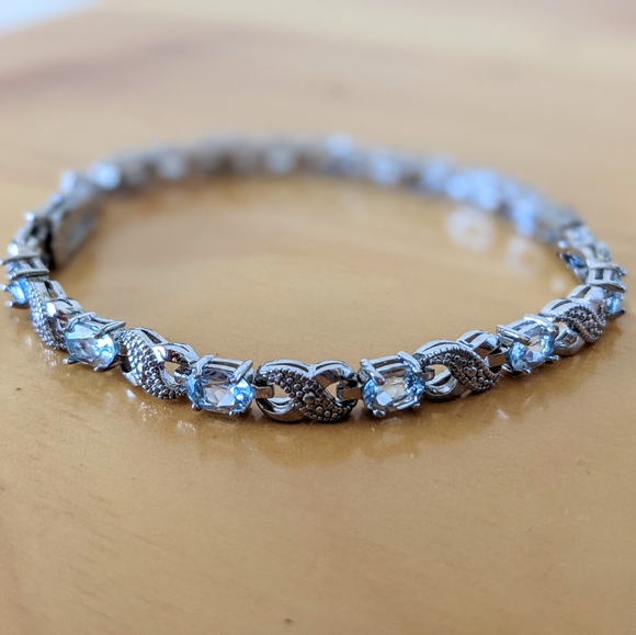 Blue Topaz and Diamond Accent Infinity Bracelet - Picture 5 of 9